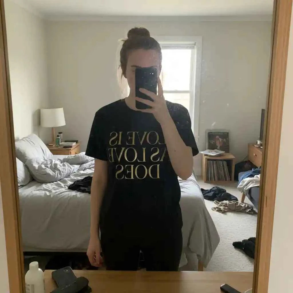 Love Is As Love Does Graphic T-Shirt - Black Cotton Tee with Gold Typography