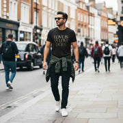 Love Is As Love Does Graphic T-Shirt - Black Cotton Tee with Gold Typography