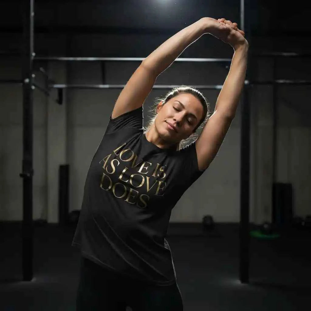 Love Is As Love Does Graphic T-Shirt - Black Cotton Tee with Gold Typography